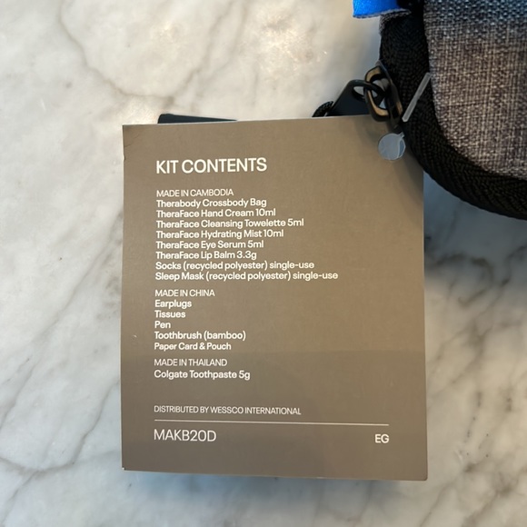 Therabody crossbody bag - filled with amazing travel products. - Picture 4 of 4